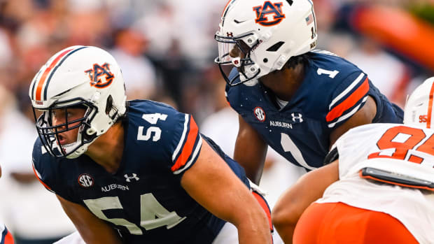 Sep 3, 2022; Auburn, Al, USA; Tate Johnson (54), T.J. Finley (1) receives the hike during the game between Auburn and Mercer at Jordan-Hare Stadium.